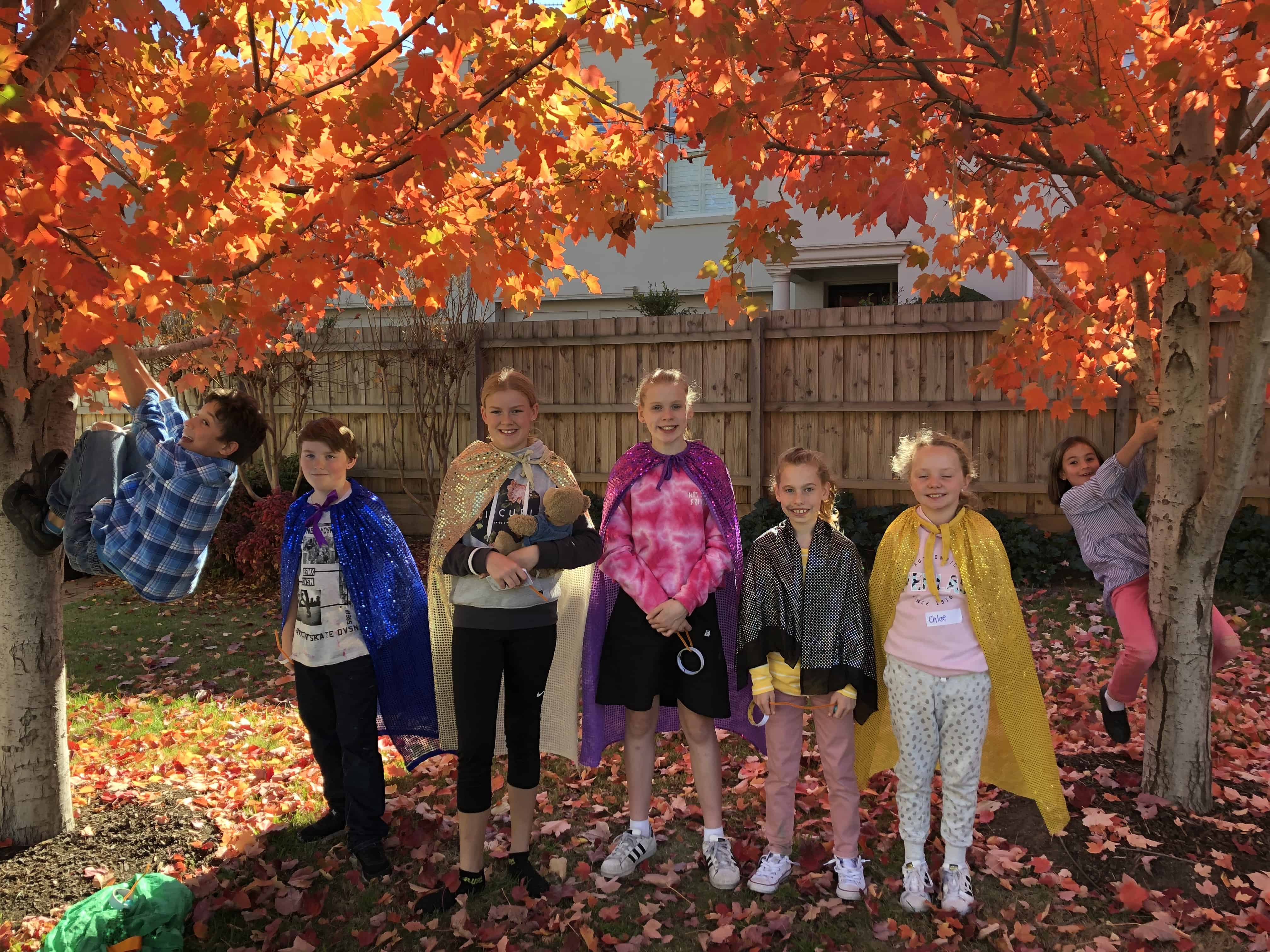 group shot with autumn tree